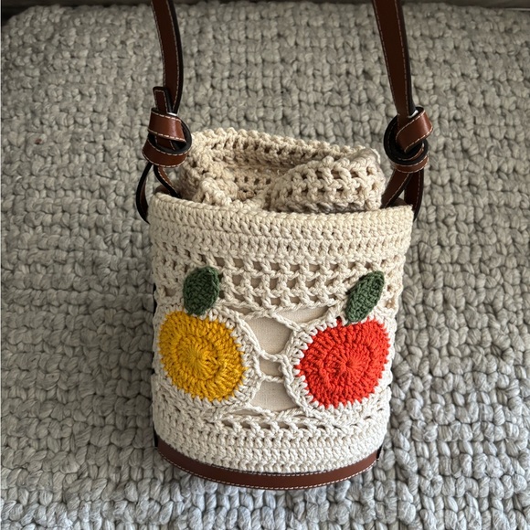 STAUD Handbags - STAUD Cream Crochet Bucket Crossbody with Yellow and Red Fruit Motifs